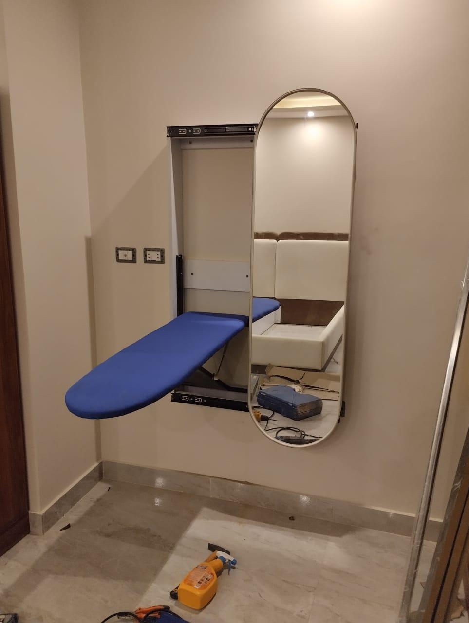 Ironing wall unit with mirror.