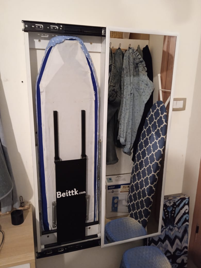 Ironing wall unit with mirror.