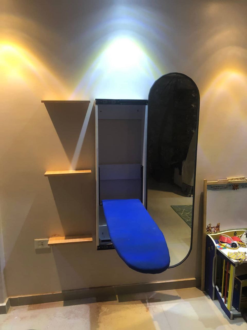 Ironing wall unit with mirror.