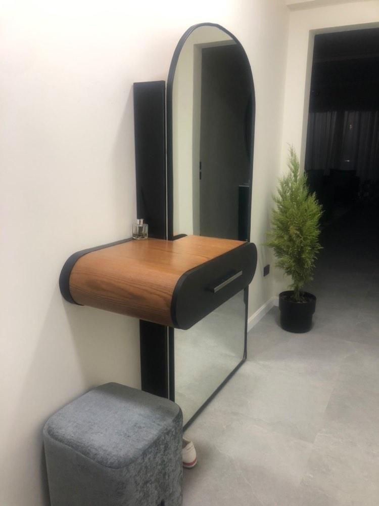 A shoe cabinet with a mirror