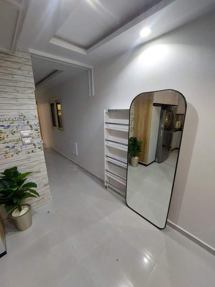 A shoe cabinet with a mirror