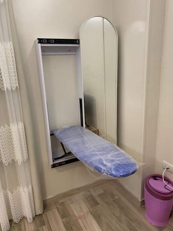Ironing wall unit with mirror.
